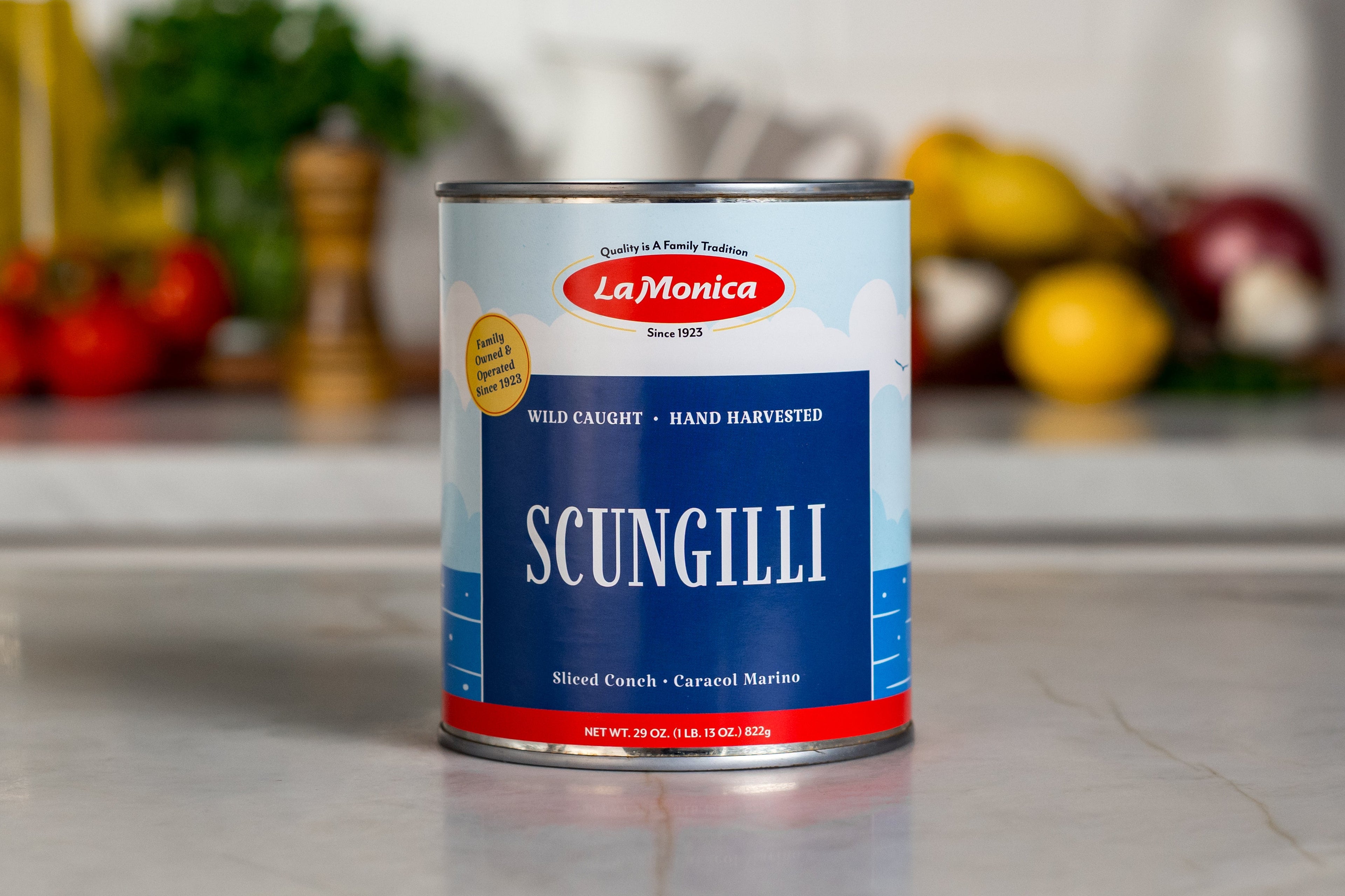Can of LaMonica Scungilli on a kitchen counter with blurred background.